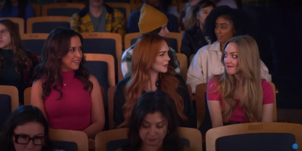 A group of Mean Girls sitting in an auditorium during Black Friday 2023.