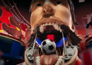 A mechanized sculpture with a human face has a soccer ball on its tongue, subtly hinting at Euro 2024. In the background, athletes in motion are depicted, adding to the dynamic scene.