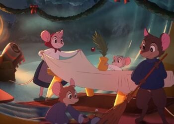 Four hand-drawn animated mice decorate a cozy room for Christmas, hanging garland and preparing a bed with a small tree and an ornament, all by the warm glow of candles—capturing the charm of a classic Christmas ad.
